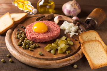 beef tartare on wooden table