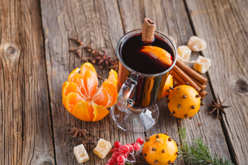 Female hold glass of hot mulled wine