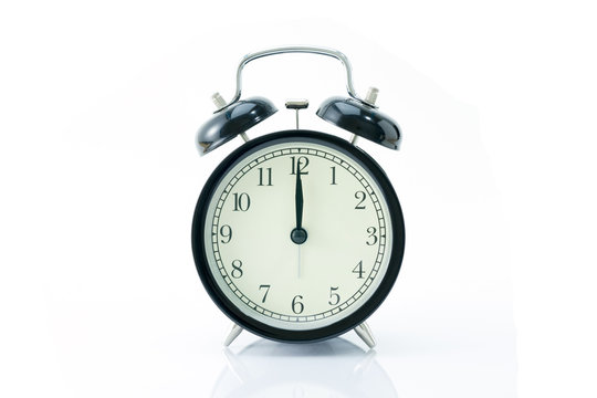 Black alarm clock isolated on white
