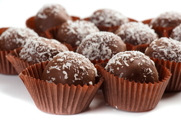 balls of chocolate covered coconut on white background