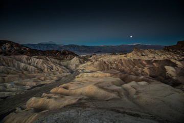 Moonset Over Rock Formations at Zabriskie Point