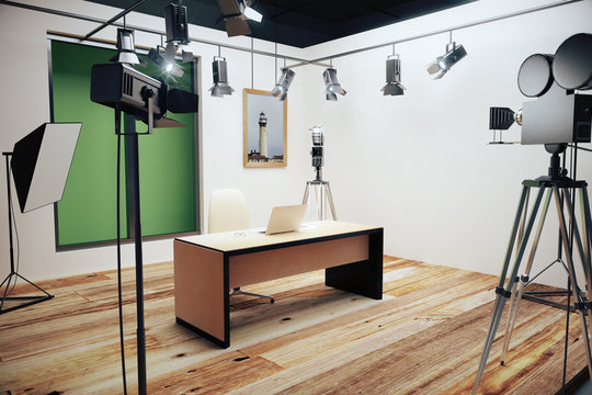 Modern photo studio with furniture and old style movie camera