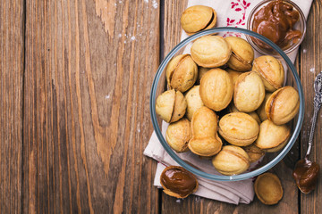 Biscuits with condensed milk in a transparent plate