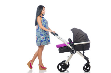 Happy mom with her baby in pram 