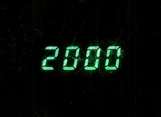 Horizontal green digital 2000 millenium display clock dust parti