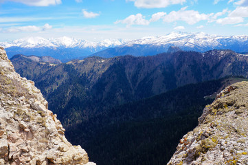 Fototapeta na wymiar Horizontal vivid mountains peaks landscape background backdrop