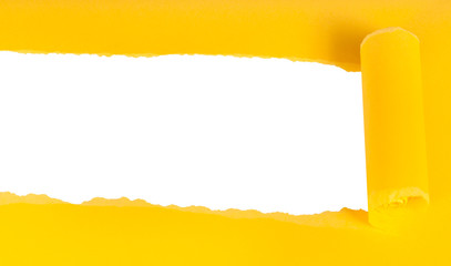below view of yellow rolled-up torn paper on white