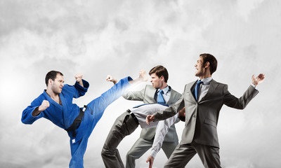 Karate man in blue kimino © Sergey Nivens