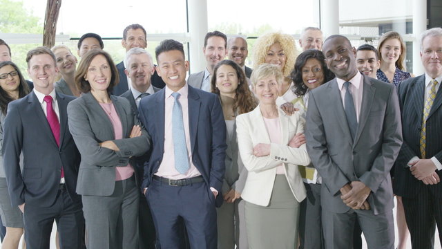  Portrait of large diverse business group smiling at the camera