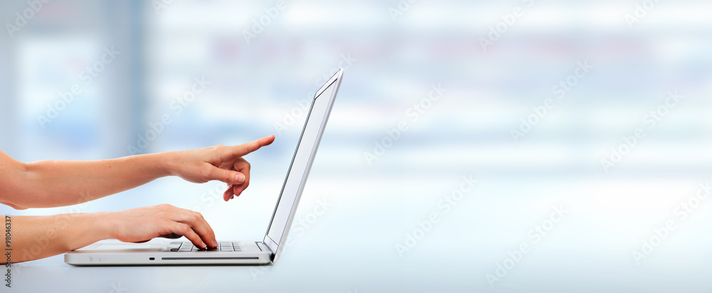 Poster hands with laptop computer.
