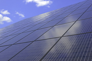 Photovoltaic system with solar panels and blue sky