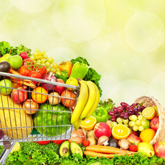 Vegetables and fruits over green background.