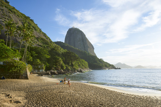 Classic view of Sugarloaf Mountain Pao de Acucar from Praia Vermelha Red Beach at Urca on a quiet morning in Rio de Janeiro, Brazil 