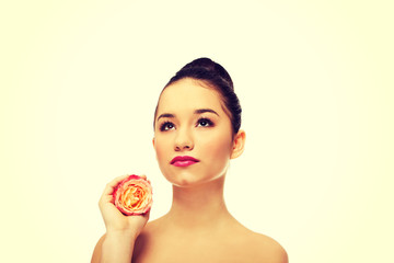 Beautiful woman with pink rose.