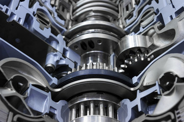 Gearbox cross-section, engine industry, sprockets, cogwheels and bearings of automotive transmission for oversize trucks, SUV, cargo, commercial and construction vehicles, selective focus 