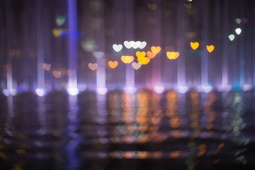 Photo Of love or heart Bokeh Lights in reflection / Street Lights Out Of Focus / filtered heart blurred background