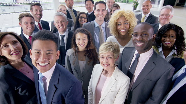  Portrait of large diverse business group smiling at the camera
