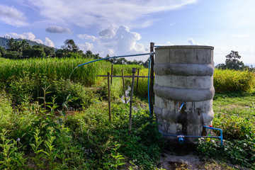 Water tank for plumbing system from cataract in countryside.