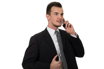 Young business man holding phone