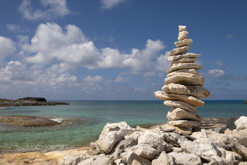 Fototapeta na wymiar Rocks balanced near a the ocean Off-center for copy space