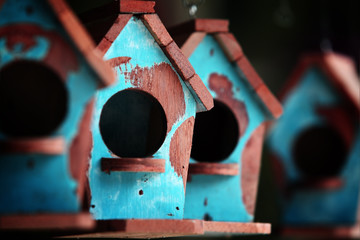 row of wooden birdhouse.