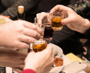 Clinking glasses with white wine and toasting