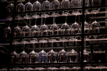 Upside down wine glasses in a bar