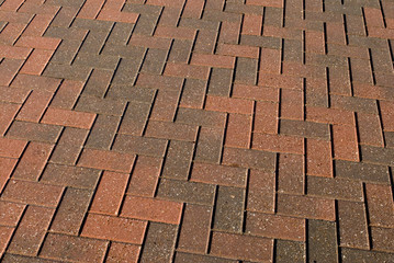 Brick pavers in herringbone pattern.