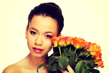 Beauty african woman with roses.