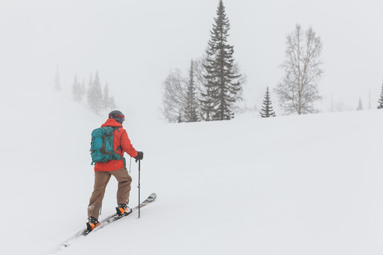 Man Skiing Snowy Slope