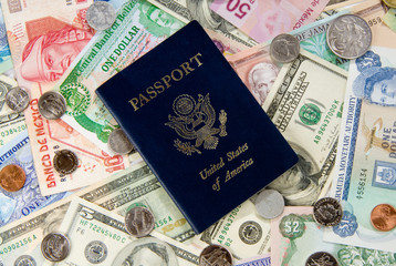 United States of America Passport with Money from Different Countries depicting a Global/World Economy and travel.