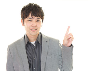 指示する笑顔のビジネスマン