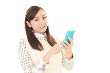 Fototapeta premium スマートフォンを持つ女性
