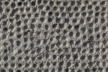 The pattern from a dots on a old stone wall