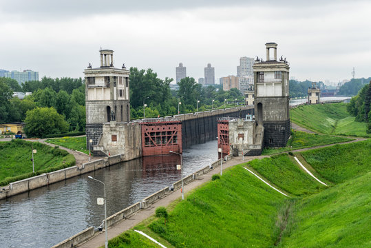 View on canal with open shipping lock against skyline. Moscow, Russia. 
