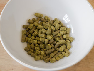 Hops pellets in white bowl