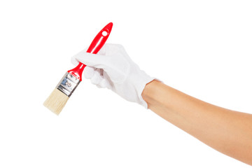 The hand in white glove with red paintbrush