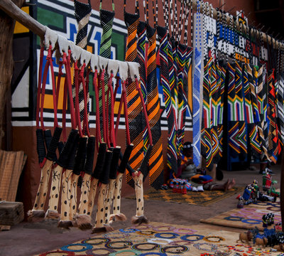 colored African ornaments made of beads and a slingshot