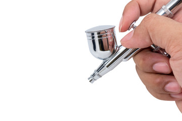 air brush spray gun in hand  isolated white background with clipping path