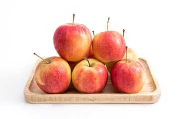 mini apple in wood plate on white background