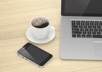 Laptop smartphone and coffee cup on wood table