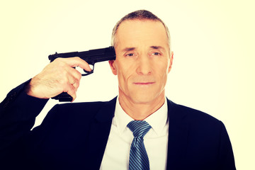 Naklejka premium Portrait of a man with handgun near head