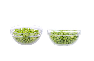 Fresh garden peas in a glass bowl.