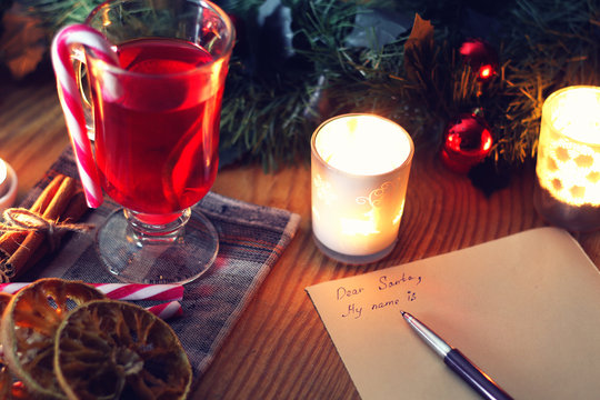 Christmas letter on the table with spices