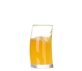 orange juice pouring into glass