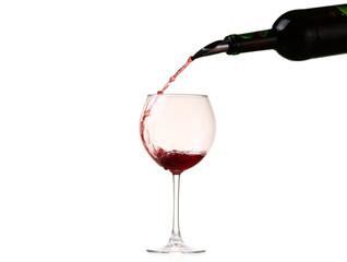 red wine glass on a white background, splash