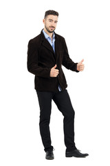 Young man in corduroy jacket with o.k. hand gesture smiling at camera. Full body length portrait isolated over white studio background.