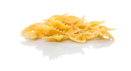 Dried italian bowtie pasta or farfalle over white background