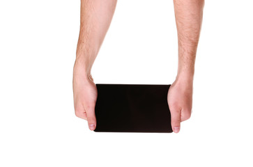 male hands holding a tablet touch computer gadget with black scr