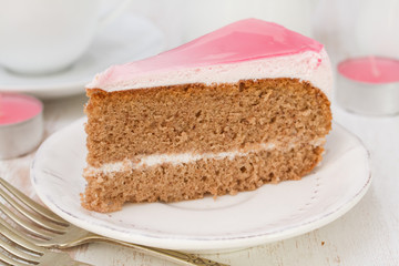 cake on white plate on white wooden background